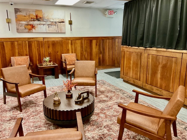 Warm reception lounge with mid-century leather seating